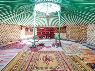 a room with a yurt with a rug on the floor at The Cottage in Penzance