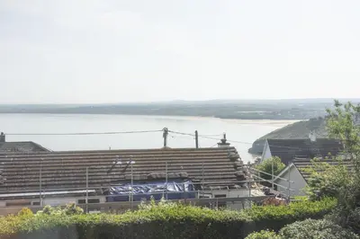 a large amphitheater with a lake in the background at The Hideaway in Porthleven