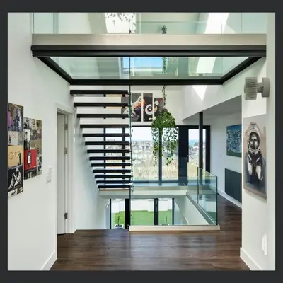 a staircase in a house with a glass ceiling at Uno St Ives - Boutique Luxury Accommodation in St Ives