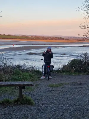 a person riding a bike next to a lake at The Hannexe in Wadebridge