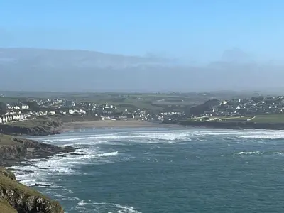 a view of the ocean and a beach with houses at The Hannexe in Wadebridge