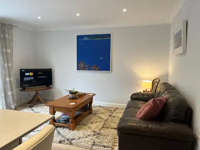 a living room with a couch and a table at The Hannexe in Wadebridge