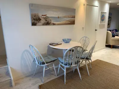 a dining room with a table and chairs at Little Karenza is the perfect Cornish getaway in Saint Anthony