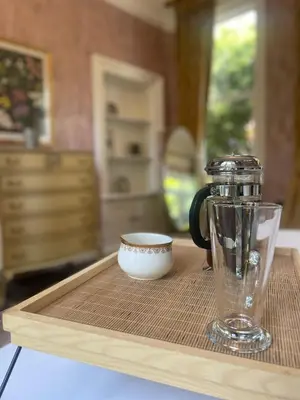 a coffee maker and a cup on a wooden tray at Penarwyn House in Par