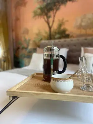 a coffee pot and a cup on a wooden tray at Penarwyn House in Par