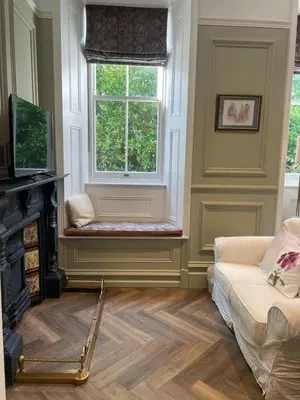 a living room with a window and a couch at Penarwyn House in Par