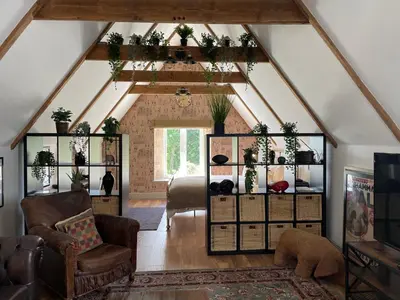 a attic living room with a vaulted ceiling at Penarwyn House in Par