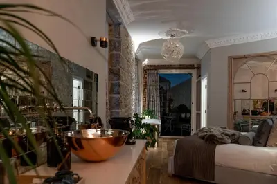 a room with a bed and a bowl on a counter at Host St Ives in St Ives