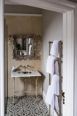 a bathroom with a sink and a mirror at Host St Ives in St Ives
