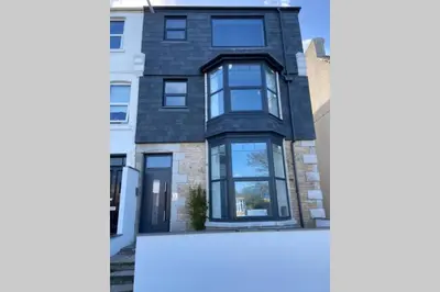 a rendering of a house with black windows at Beachside apartment in the centre of town in Newquay