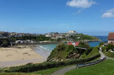 a view of a beach with people on the sand at Beachside apartment in the centre of town in Newquay