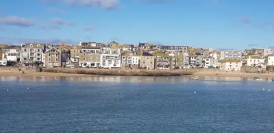 a view of a town with a beach and buildings at Stargazy Shepherds Hut in St Ives