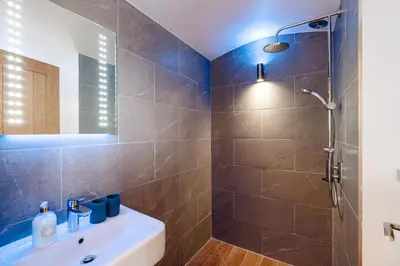 a bathroom with a shower and a sink at Mount View Overnight Accommodation in Penzance