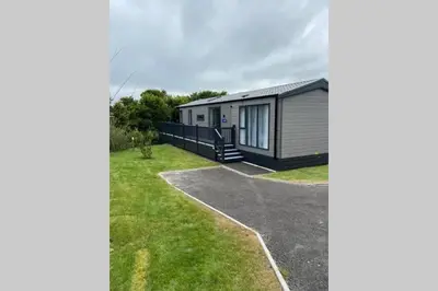 a tiny house is shown from the street at Lowena Lodge - Padstow in Padstow