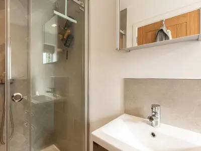 a bathroom with a sink and a shower at Pentire in Saint Minver
