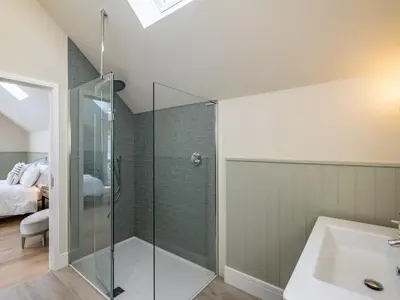 a bathroom with a shower and a sink at Seascape in Polzeath