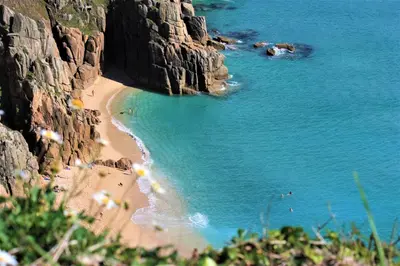 a view of a beach with people on the sand at Little Chyryn Perranuthnoe in Perranuthnoe