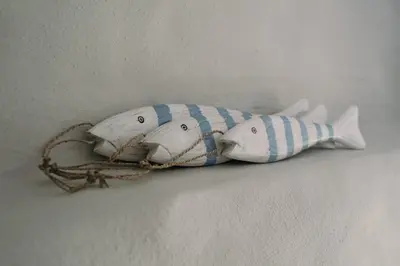 two stuffed fishes attached to a wall at Swallow Cottage in Port Isaac