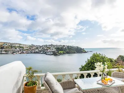 a balcony with a view of the ocean at Apartment 2 The Wheelhouse in Fowey