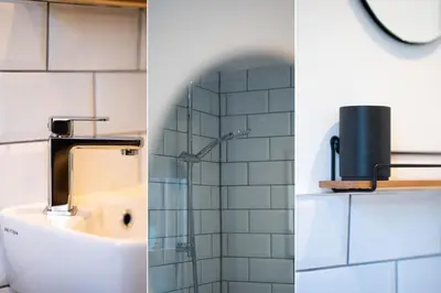 two pictures of a bathroom with a sink and a shower at 23 Trenwith Place in St Ives