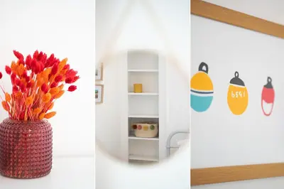 a vase with flowers in it next to a shelf at 23 Trenwith Place in St Ives
