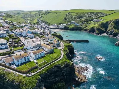 an aerial view of a town next to the ocean at Gulland in Port Isaac