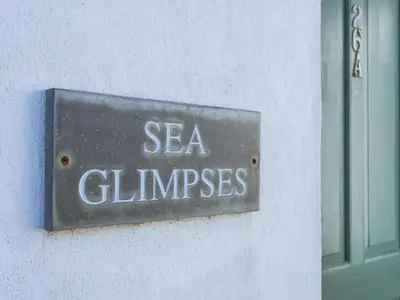 a sign that says sea climps on a wall at Sea Glimpses in Port Isaac