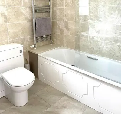 a bathroom with a toilet and a tub and a sink at Sunny Corner, Padstow. Spacious 3 bedrooms, 2.5 bathrooms, parking, garden. in Padstow