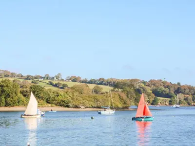 a group of boats floating on a body of water at Sycamore Lodge in Helston