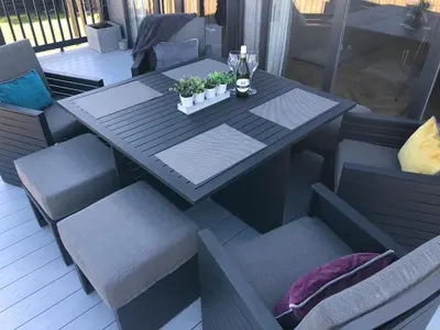 a table and chairs with plants on a patio at Padstow Lodge - Padstow Holiday Village in Padstow