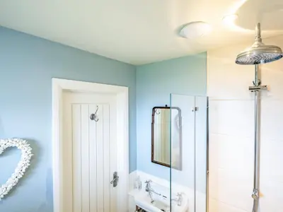 a bathroom with a shower and a sink at Atlantis in Polzeath