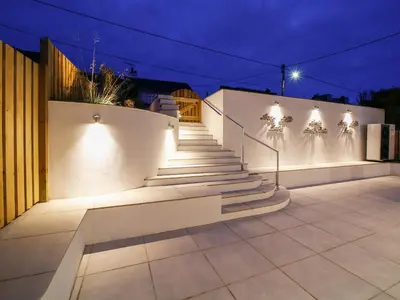a set of stairs with lights on the side of a building at Seahaven in Port Isaac