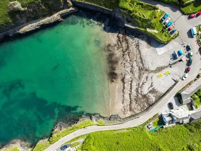 an aerial view of a beach and water at Seahaven in Port Isaac