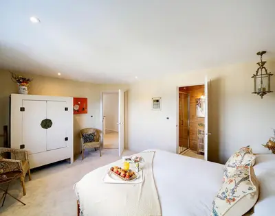 a bedroom with a bed with a plate of fruit on it at Seahaven in Port Isaac
