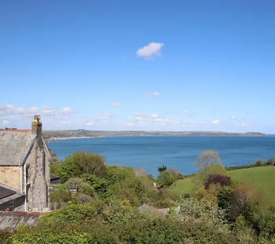 a house with a view of a body of water at Seaside Holiday Cottage Near Beach in Charlestown