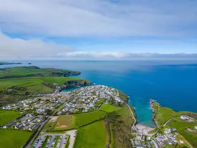 an aerial view of a resort near the ocean at Swallow Cottage, Trewetha Farm in Port Isaac