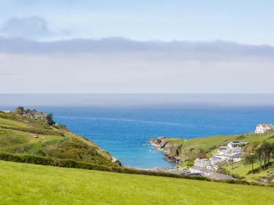 a view of the ocean from a hill at Dolphin Lodge in Port Isaac
