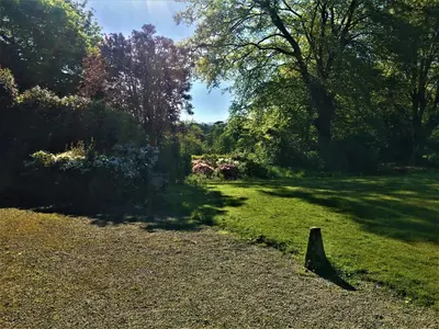 a cone in the middle of a field with trees at Wodehouse in Falmouth