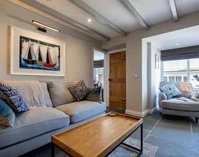 a living room with a couch and a coffee table at Mino Cottage in Port Isaac