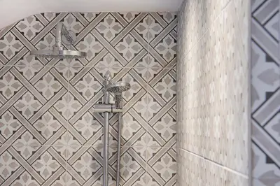 a shower in a bathroom with a tiled wall at Cusgarne Manor boutique B&B - adults only in Cusgarne