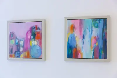 two pieces of art hanging on a wall at Puffins in St Ives