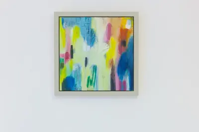 a framed painting on a white wall at Puffins in St Ives