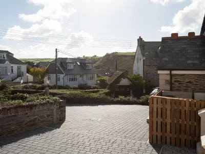 a view of a town with houses and a driveway at Church Rooms in Port Isaac