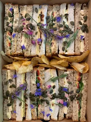 a box of sandwiches with flowers on it at The Cottage Bed & Breakfast in Polperro