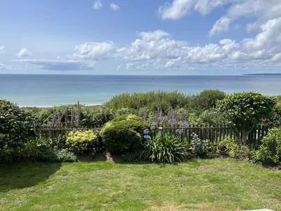 a garden with a view of the ocean at Stonecroft in Praa Sands