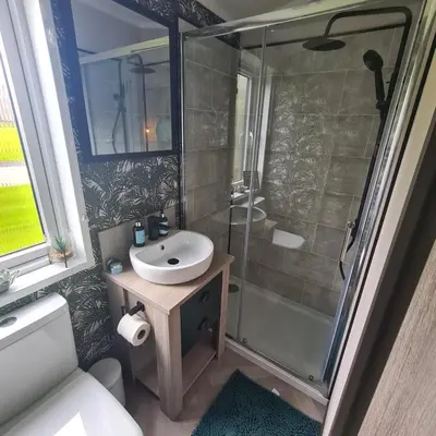 a bathroom with a sink and a shower at Mawgan Pads Padstow in Padstow