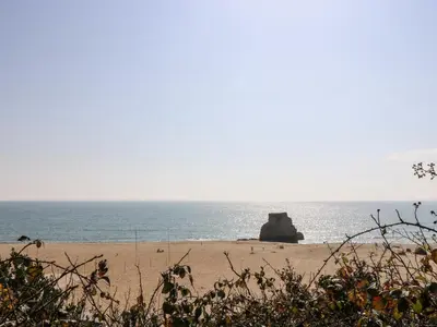 a view of a beach with the ocean in the background at Wheal ProsperThe West Dry in St Austell