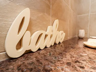 a bathroom with a sign that says toilets on the floor at Sky in St Ives