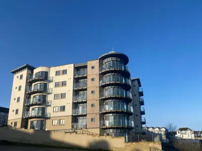 an apartment building with balconies on the side of it at Amazing 2-bedroom apartment with lovely sea views in Newquay
