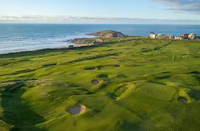 an aerial view of a golf course next to the ocean at Amazing 2-bedroom apartment with lovely sea views in Newquay